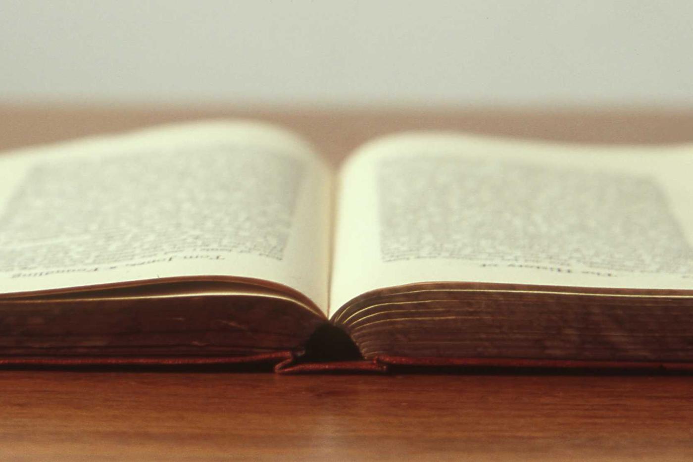 Notebook and pen on a desk before bedtime
